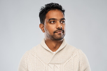 Image showing indian man in knitted sweater over gray background