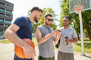 Image showing men with smartphone on basketball playground