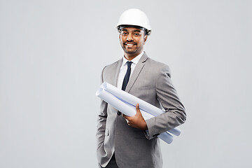 Image showing indian male architect in helmet with blueprints