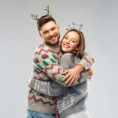 Image showing happy couple at christmas ugly sweater party