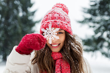 Image showing portrait of teenage girl with snowflake in winter