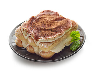 Image showing Tiramisu dessert on black plate