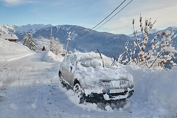 Image showing Winter road and snowy car