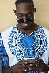 Image showing native african black man using smart phone