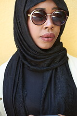 Image showing african woman using smartphone wearing traditional islamic clothes