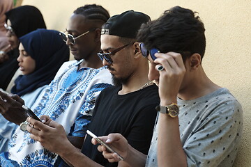 Image showing multiethnic startup business people group using smart phones