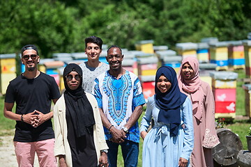 Image showing people group visiting local honey production farm