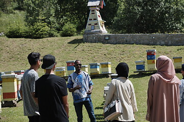 Image showing people group visiting local honey production farm