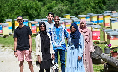 Image showing people group visiting local honey production farm