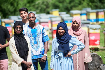 Image showing people group visiting local honey production farm