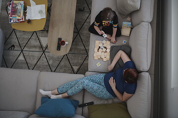 Image showing mother and daughter at home playing memory game