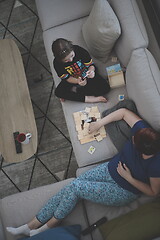 Image showing mother and daughter at home playing memory game