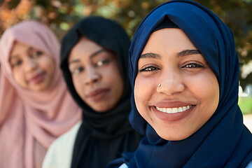 Image showing businesswoman group portrait wearing traditional islamic clothes