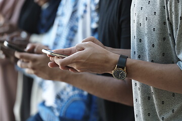 Image showing multiethnic startup business people group using smart phones