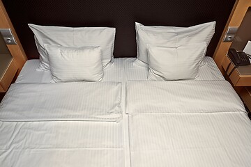 Image showing Hotel bed with white sheets