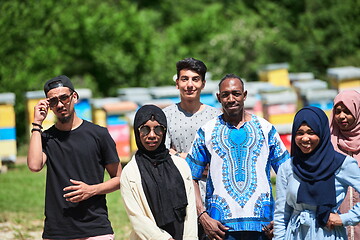 Image showing people group visiting local honey production farm