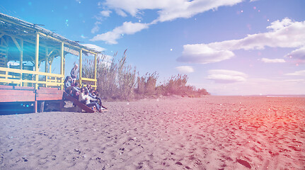 Image showing Group of friends having fun on autumn day at beach