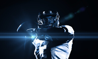 Image showing american football player throwing rugby ball