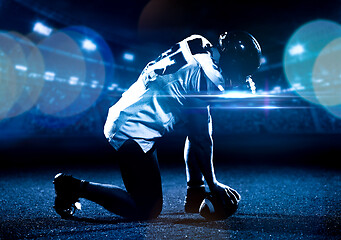 Image showing American football player starting football game