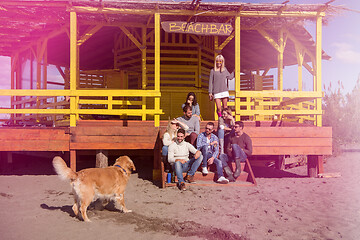 Image showing Group of friends having fun on autumn day at beach