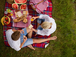 Image showing top view of couple enjoying picnic time