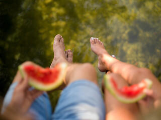 Image showing Couple eating watermelon enjoying picnic time