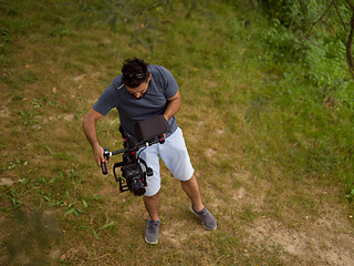 Image showing videographer at work in beautiful nature