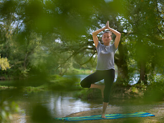 Image showing woman meditating and doing yoga exercise