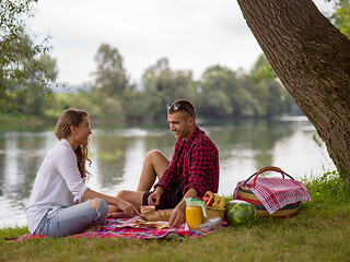 Image showing Couple in love enjoying picnic time