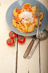 Image showing Italian snail lumaconi pasta with tomatoes