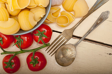 Image showing Italian snail lumaconi pasta with tomatoes