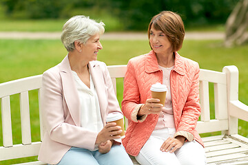 Image showing senior women or friends drinking coffee at park