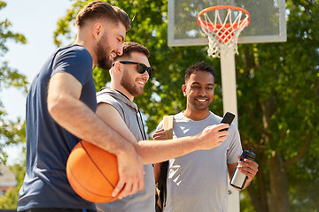 Image showing men with smartphone on basketball playground