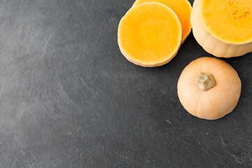 Image showing cut pumpkin on stone background