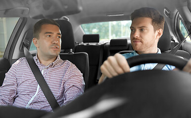 Image showing car driving school instructor and male driver