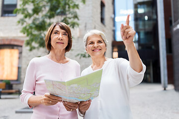 Image showing senior women with city map on street in tallinn