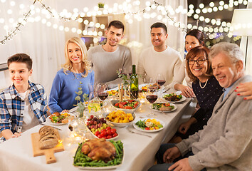 Image showing happy family having dinner party at home