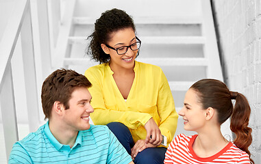 Image showing teenage friends or students hanging out on stairs