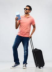 Image showing indian man with travel bag passport and air ticket