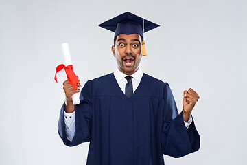 Image showing happy graduate student in mortarboard with diploma