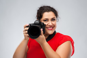 Image showing happy woman photographer with digital camera