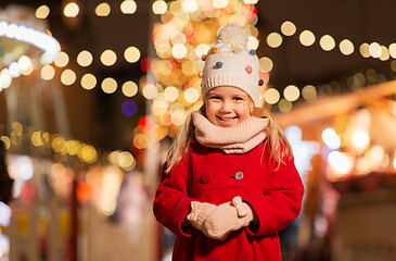 Image showing happy little girl at christmas market in winter