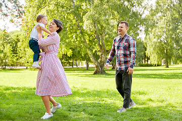 Image showing happy family having fun at summer park