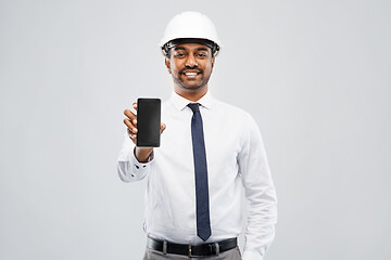 Image showing indian male architect in helmet showing smartphone