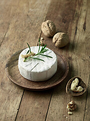 Image showing fresh brie cheese and walnuts