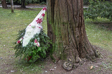 Image showing Small garden dwarf made of pine twigs as a Christmas decoration 