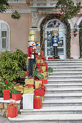 Image showing Wooden figures of the Nutcracker and gift boxes as Christmas dec