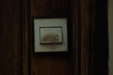 Image showing Close up on a filthy old electric doorbell fitting