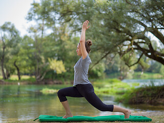 Image showing woman meditating and doing yoga exercise