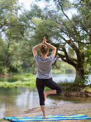 Image showing woman meditating and doing yoga exercise